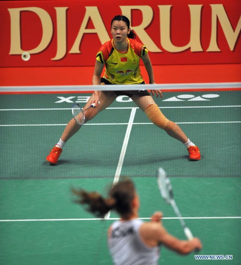 Li Xuerui of China competes during the women's singles final match against Juliane Schenk of Germany at the Djarum Indonesia Open 2013 in Jakarta, Indonesia, June 16, 2013. Li Xuerui won 2-1. (Xinhua/Agung Kuncahya B)