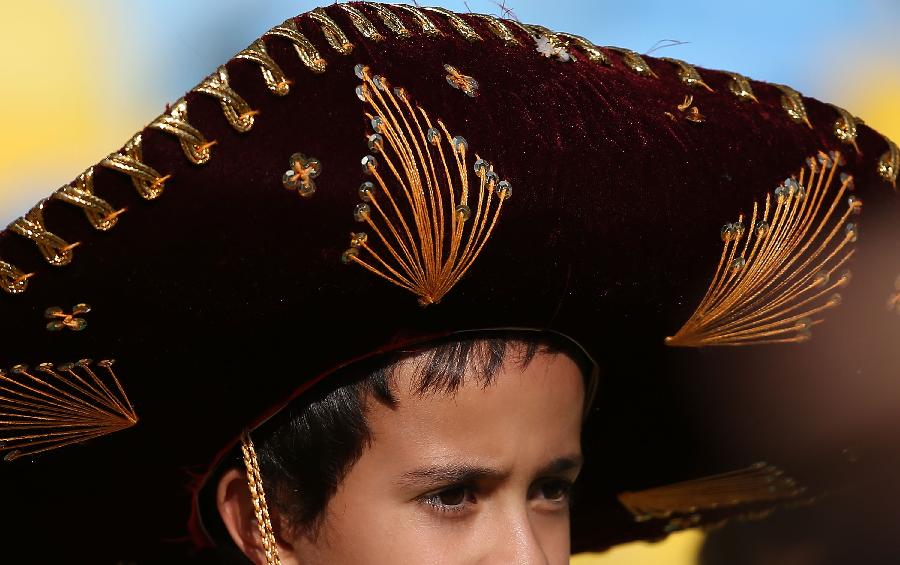 A Mexico's fan reacts prior to the FIFA's Confederations Cup Brazil 2013 match against Italy held at the Maracana Stadium, in Rio de Janeiro, Brazil, on June 16, 2013. (Xinhua/Liao Yujie)