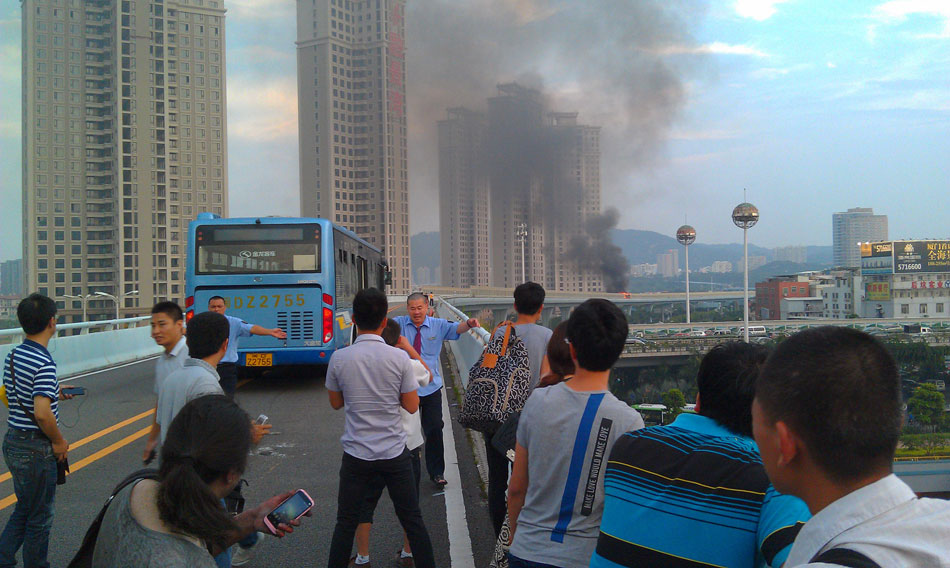 A bus lane is closed after a man set fire to a crowded bus to "vent personal grievances" in Xiamen, southeast China’s Fujian province, June 7, 2013. The fatal bus fire killed 47 people including the arsonist and injured 34. (Photo/Xinhua) 