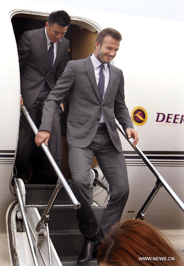 Recently retired football player David Beckham arrives in Shanghai, east China, June 19, 2013. David Beckham is on a seven-day visit to China as the ambassador for the Football Programme in China and China's Super League. (Xinhua/Fan Jun) 