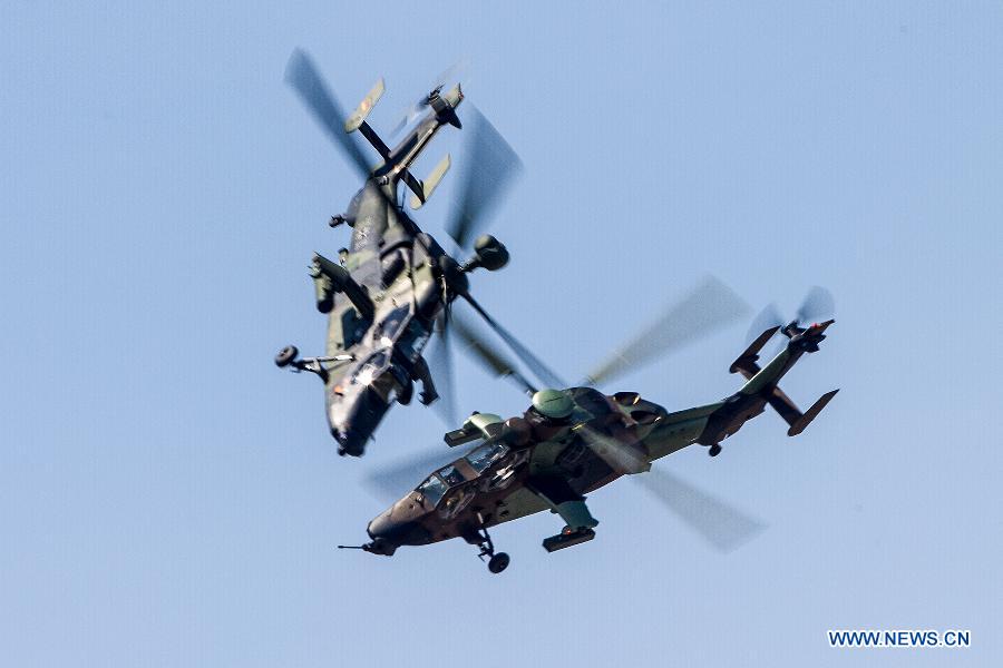 Tiger helicopters participate in a flying display during the 50th International Paris Air Show at the Le Bourget airport in Paris, France, June 17, 2013. The Paris Air Show runs from June 17 to 23. (Xinhua/Chen Cheng)