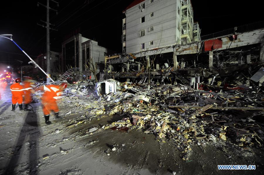 Fire fighters search for survivors at the blast accident scene at a restaurant in Shuozhou City, north China's Shanxi Province, June 20, 2013. Blasts ripped through a restaurant in Shuozhou Wednesday night, killing two people and injuring over 150 others. The explosion of natural gas pipes was suspected to be the cause of the accident after an initial investigation. (Xinhua/Yan Yan)