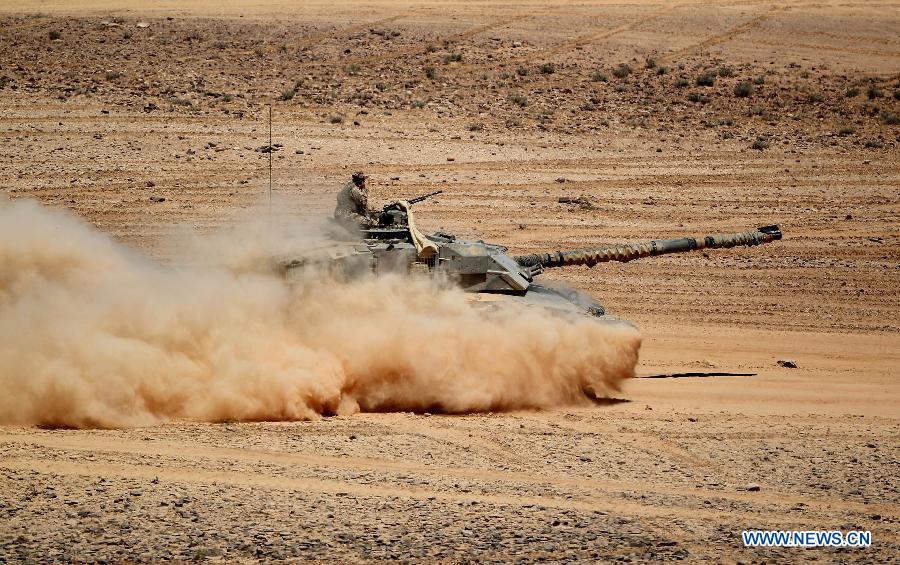 A U.S. tank participates in the Eager Lion military exercise, at the Quweira city, 290km south of Amman, Jordan, June, 19, 2013. The 12-day exercise involves combined air, land and sea maneuvers across Jordan. Along with Jordan and the U.S., the exercise brings together some 8,000 personnel from 19 Arab and European nations to train on border security, irregular warfare, anti-terrorism and counterinsurgency. (Xinhua/Mohammad Abu Ghosh)