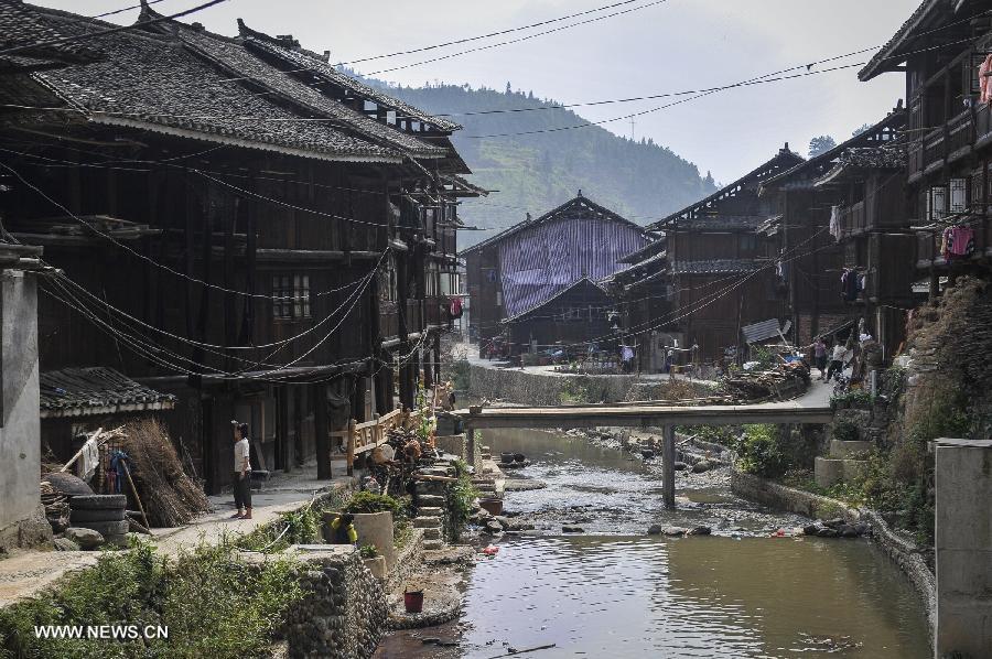 Photo taken on June 20, 2013 shows the scenery of Zhaoxing Dong Village in Liping County, southwest China's Guizhou Province. Zhaoxing Dong Village is one of the largest Dong village in Guizhou. In 2005, it was ranked one of China's six most beautiful villages and towns by Chinese National Geography. (Xinhua/Ou Dongxu) 