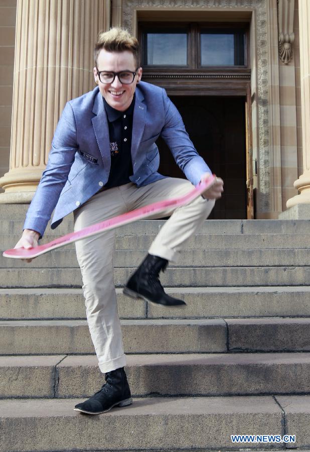 Andrew Smith from the United States cheers after winning the job 'Chief Funster in New South Wales' in Sydney, Australia, on June 21, 2013. Six young men and women have beaten off more than 330,000 competitors from 196 countries and regions to be awarded Tourism Australia's 'Best Jobs in the World'. They are expected to commence their jobs between August and December 2013. Tourism Australia's 'Best Jobs in the World' competition is part of a major international marketing push to promote tourism opportunities provided by Australia's Working Holiday Maker program. (Xinhua/Jin Linpeng)