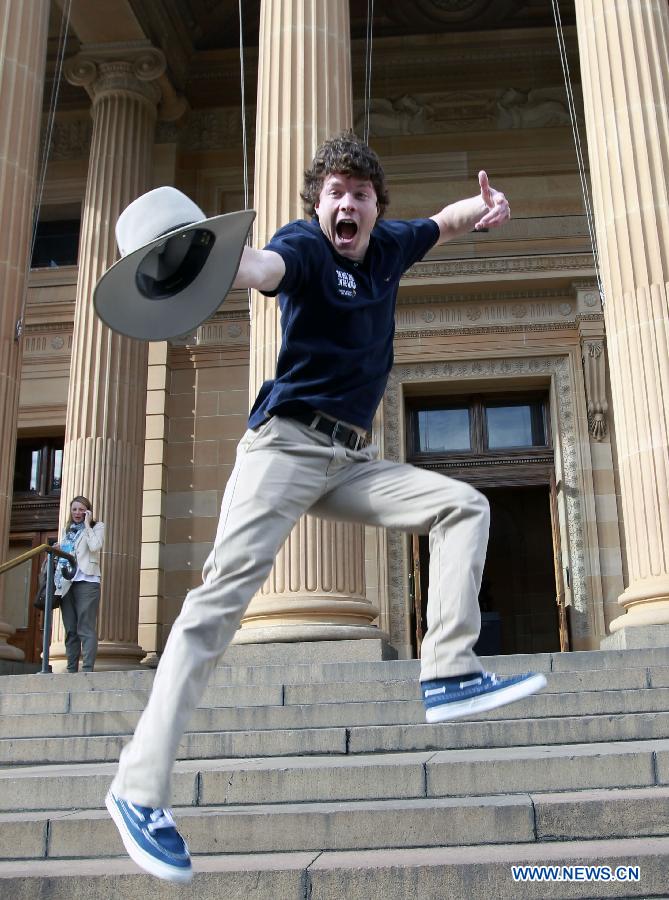 Allan Dixon from Ireland cheers after winning the job 'Outback Adventurer in Northern Territory' in Sydney, Australia, on June 21, 2013. Six young men and women have beaten off more than 330,000 competitors from 196 countries and regions to be awarded Tourism Australia's 'Best Jobs in the World'. They are expected to commence their jobs between August and December 2013. Tourism Australia's 'Best Jobs in the World' competition is part of a major international marketing push to promote tourism opportunities provided by Australia's Working Holiday Maker program. (Xinhua/Jin Linpeng)