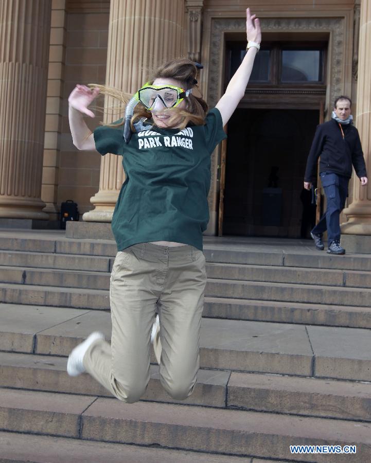 Alisa Detrez from France cheers after winning the job 'Park Ranger in Queensland' in Sydney, Australia, on June 21, 2013. Six young men and women have beaten off more than 330,000 competitors from 196 countries and regions to be awarded Tourism Australia's 'Best Jobs in the World'. They are expected to commence their jobs between August and December 2013. Tourism Australia's 'Best Jobs in the World' competition is part of a major international marketing push to promote tourism opportunities provided by Australia's Working Holiday Maker program. (Xinhua/Jin Linpeng)