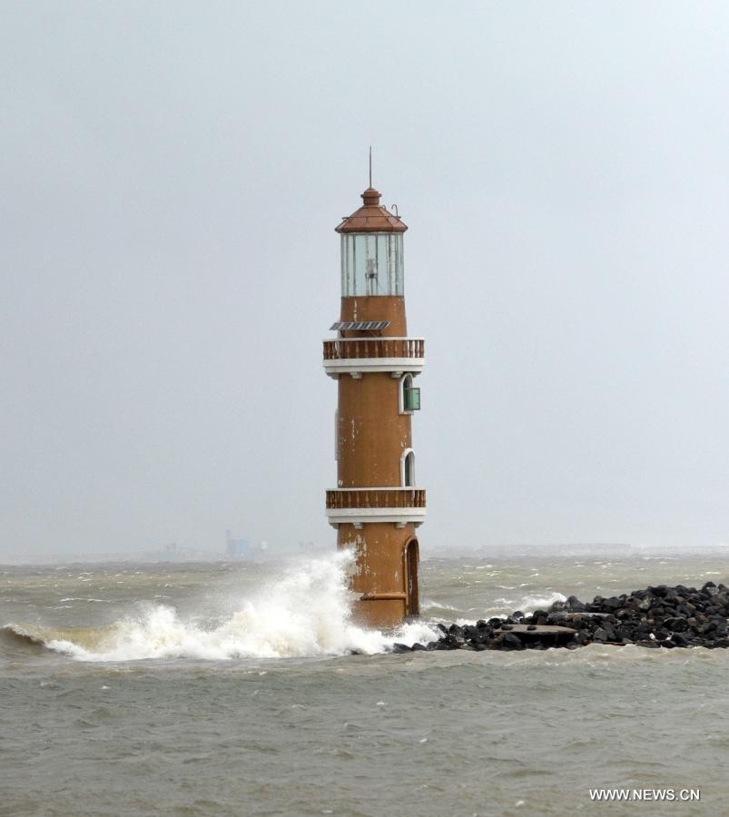Huge waves hit the lighthouse in Haikou, capital of south China's Hainan Province, Jun 22, 2013. Tropical storm "Bebinca" is estimated to arrive in south China's Guangdong Province on Saturday afternoon, the first to make landfall in China this year, the National Meteorological Center (NMC) said on Saturday. Affected by the tropical storm, coastal areas in Hainan and Guangdong provinces were battered by gales and torrential rain, the center reported. (Xinhua/Zhao Yingquan) 