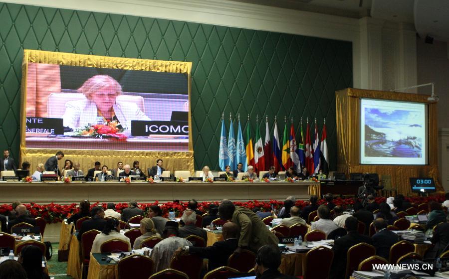 Delegates attend the 37th session of the World Heritage Committee in Phnom Penh, Cambodia, June 22, 2013. The UNESCO's World Heritage Committee inscribed China's cultural landscape of Honghe Hani Rice Terraces onto the prestigious World Heritage List on Saturday, bringing the total number of World Heritage Sites in China to 45. (Xinhua/Li Ying)  