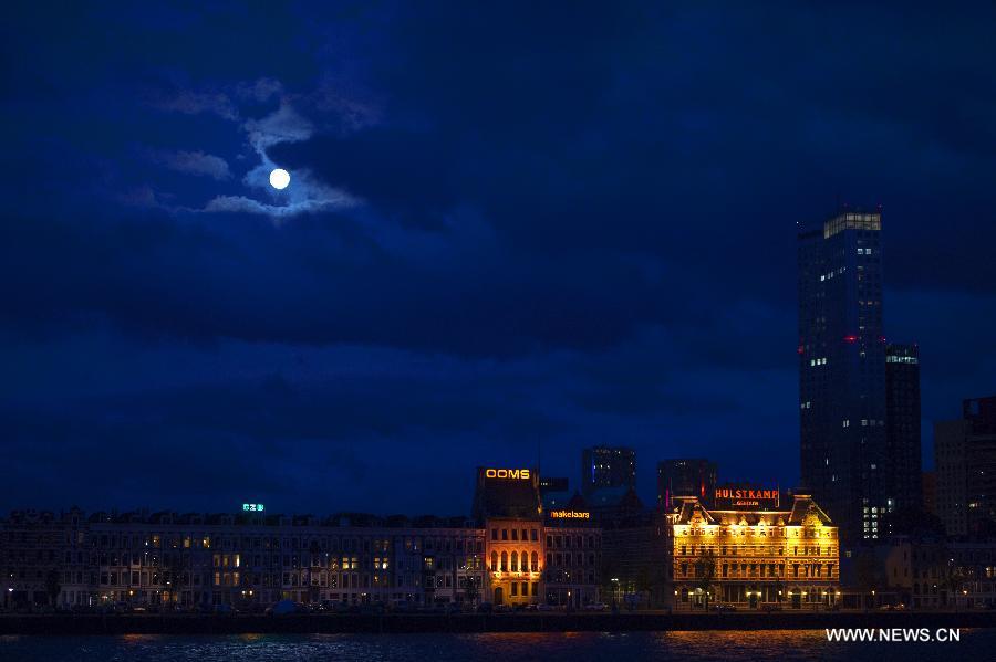 A super moon hangs in the sky over Rotterdam, the Netherlands, on June 22, 2013. On Saturday a perigee moon coincided with a full moon creating a "super moon" when it passed by the earth at its closest point in 2013. (Xinhua/Robin Utrecht)