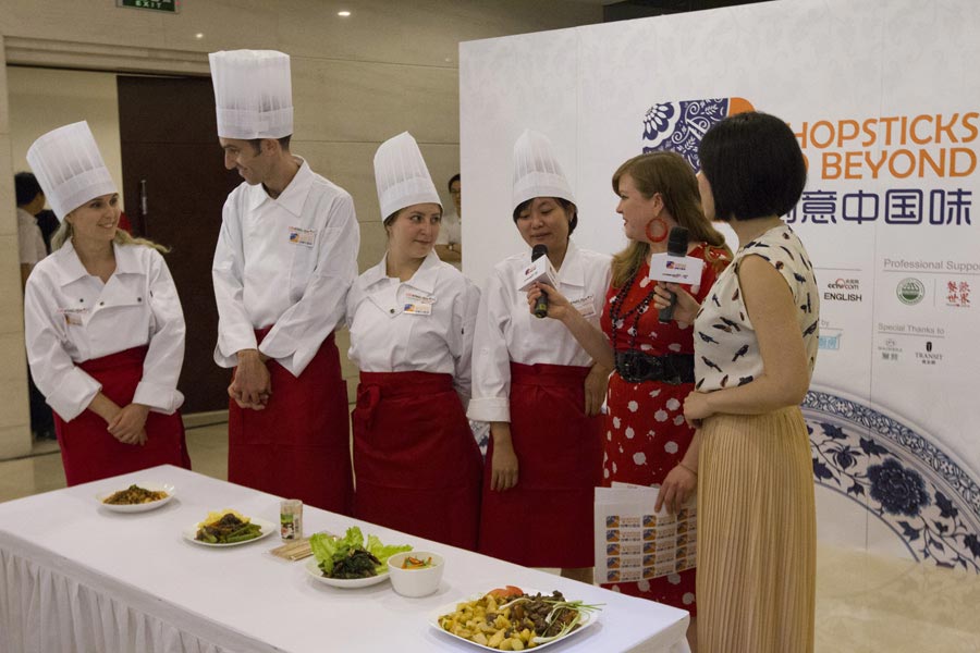 Ying Si from Thailand shows her winning “Sichuan Beef and Salad” at the "Chopsticks and Beyond" Sichuan Cuisine Competition, in Beijing, June 22, 2013. "Chopsticks and Beyond" is a Chinese cuisine challenge launched by CRIENGLISH.com to provide a platform for foreign food enthusiasts to show off their Chinese cooking skills and explore creative dishes with exotic flavor. It features China's four great traditions: Sichuan Cuisine, Cantonese Cuisine, Shandong Cuisine and Huaiyang Cuisine.(Xinhuanet/Yang Yi)