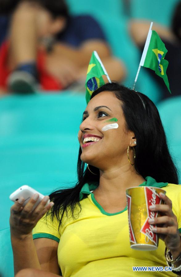 A fan of Brazil reacts prior to the FIFA's Confederations Cup Brazil 2013 match between Uruguay and Nigeria in Salvador, Brazil, on June 20, 2013. Uruguay won 2-1. (Xinhua/Nicolas Celaya)