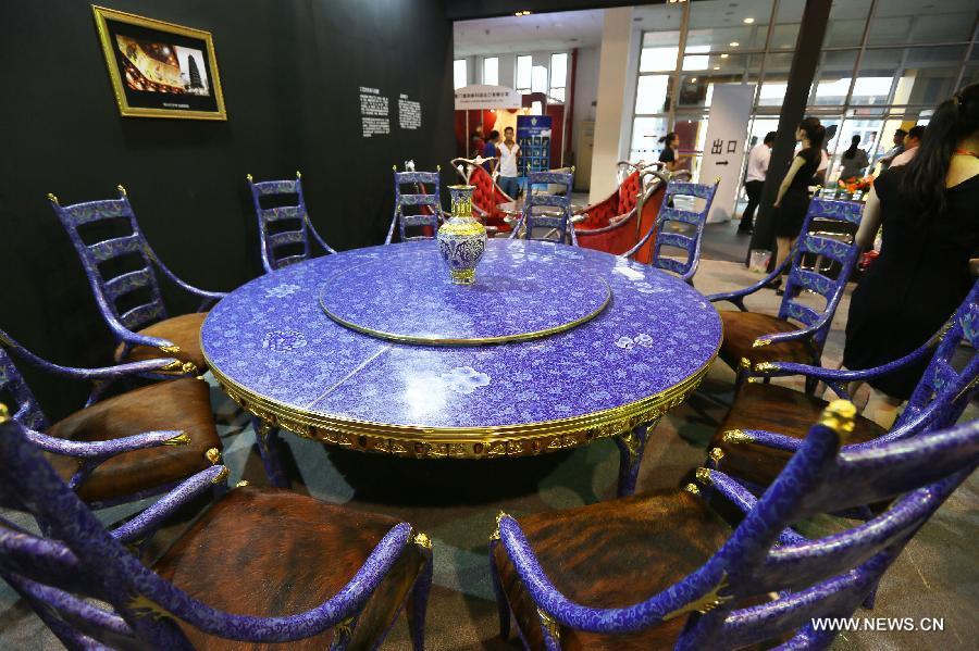 Photo taken on June 22 shows enamel dinning table and chairs at the Luxury China 2013 exhibition in Beijing, capital of China. The 3-day exhibition kicked off on Saturday, with over 300 exhibitors participated. (Xinhua)