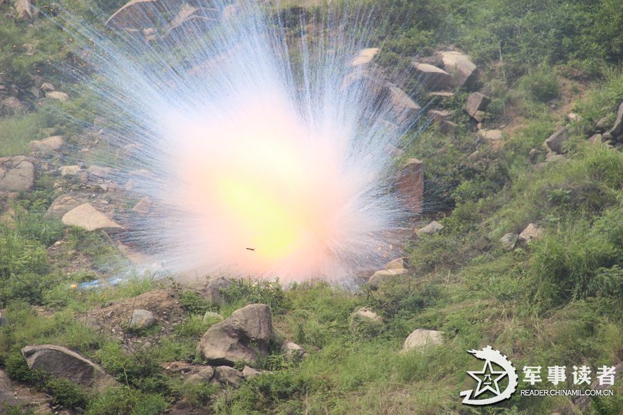 A brigade under the Nanjing Military Area Command (MAC) of the Chinese People's Liberation Army conducted anti-chemical drill from June 9 to June 11, 2013, so as to improve the actual-combat capability of its troops. The photo features the scene of the moment that a target is precisely hit. (Chinamil.com.cn/Yu Jinhu and Mao Heping)