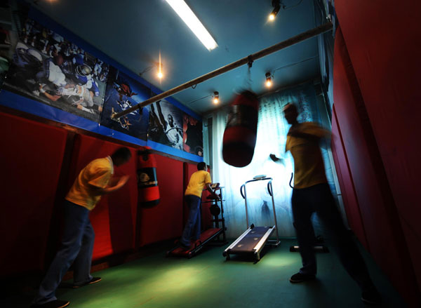 Youngsters recovering from drug addiction exercise at a rehab center in Shanxi, June 13, 2013.