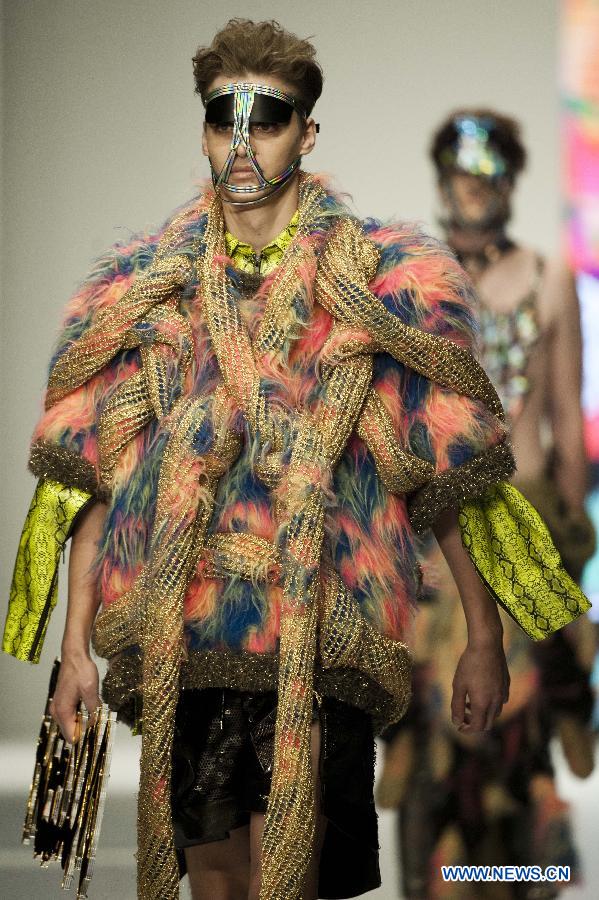 Models present creations by graduates from the Institute of Textiles and Clothing in Hong Kong Polytechnic University during their graduation show in Hong Kong, south China, June 26, 2013. (Xinhua/Lui Siu Wai)