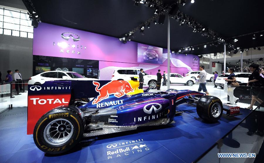 A racing car is displayed at the 12th Shenyang International Automobile Industry Expo in Shenyang, capital of northeast China's Liaoning Province, June 27, 2013. (Xinhua/Pan Yulong)