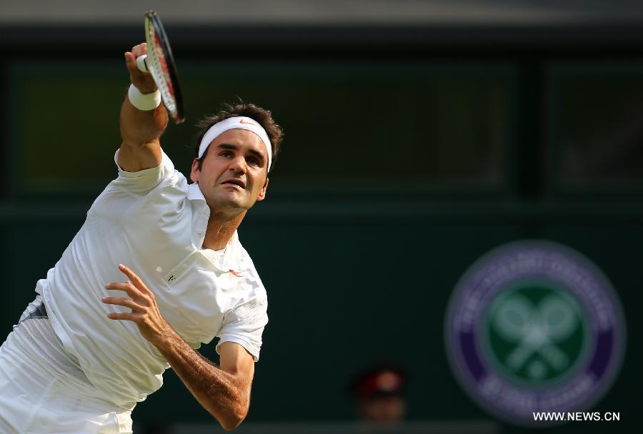 Roger Federer of Switzerland reacts during the second round of men's singles against Sergiy Stakhovsky of Ukraine on day 3 of the Wimbledon Lawn Tennis Championships at the All England Lawn Tennis and Croquet Club in London, Britain, on June 26, 2013. Roger Federer lost 1-3. (Xinhua/Yin Gang)