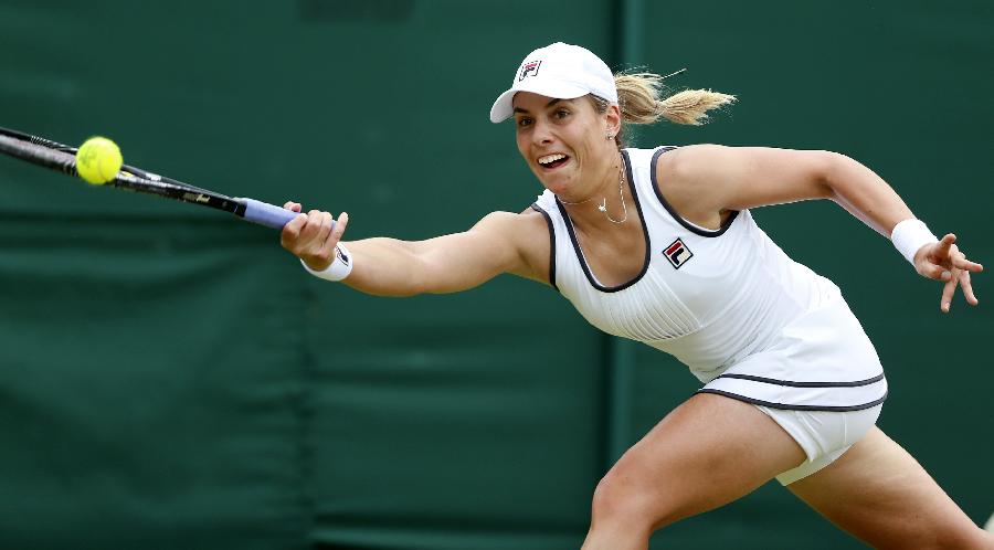 Marina Erakovic of New Zealand returns the ball during the second round of ladies' singles against Peng Shuai of China on day 4 of the Wimbledon Lawn Tennis Championships at the All England Lawn Tennis and Croquet Club in London, Britain on June 27, 2013. (Xinhua/Wang Lili)