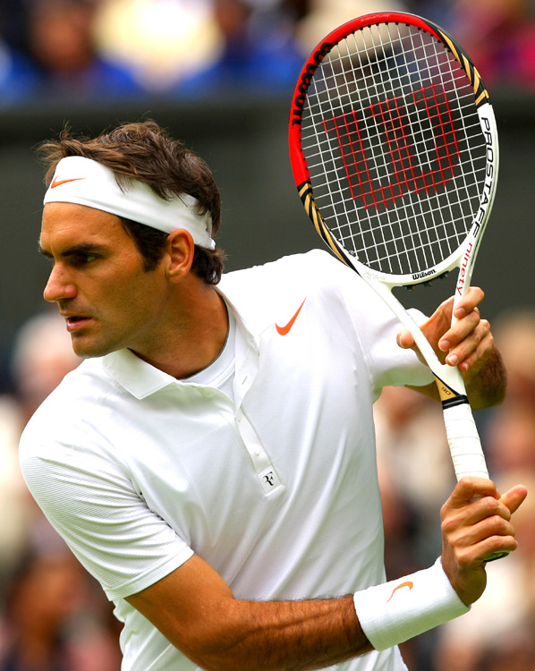 Roger Federer in the first round of men's singles against Victor Hanescu of Romania on day one of the 2013 Wimbledon Lawn Tennis Championships at the All England Lawn Tennis and Croquet Club in London, Britain on June 24, 2013. Federer won 3-0. (Photo/Osports)