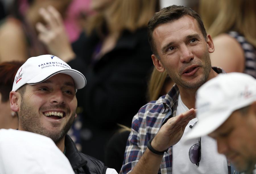 Andriy Mykolayovych Shevchenko (R), a retired Ukrainian footballer and a current Ukrainian politician, watches the second round match of men's singles between Novak Djokovic of Serbia and Bobby Reynolds of the United States on day 4 of the Wimbledon Lawn Tennis Championships at the All England Lawn Tennis and Croquet Club in London, Britain, on June 27, 2013. Novak Djokovic won 3-0. (Xinhua/Wang Lili)