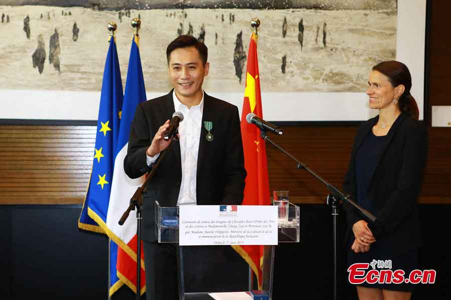 Liu Ye delivers a speech after he was awarded the Order of Arts and Letters by the French government in Beijing, capital of China, June 27, 2013. Established in 1957, the order is the recognition of significant contributions to the arts and literature. (CNS/Li Xueshi)