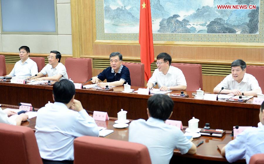 Chinese Vice Premier Wang Yang (3rd R, rear) speaks at a plenary meeting of China's State Council Leading Group of Poverty Alleviation and Development in Beijing, capital of China, June 28, 2013. (Xinhua/Li Tao)