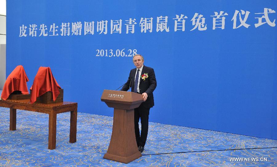 Francois-Henri Pinault, CEO of PPR Foundation and the "owner" of two bronze animal head sculptures, addresses a handover ceremony of the heads plundered by western invaders one-and-a-half centuries ago in Beijing, capital of China, June 28, 2013. The heads of a rat and a rabbit, parts of a fountain clock that previously stood at the Old Summer Palace, or "Yuanmingyuan" in Chinese, were donated on April 26, 2013 by the Pinault family, which owns the French luxury brand Kering. The handover ceremony was held Friday at National Museum of China. (Xinhua/Li Xin) 