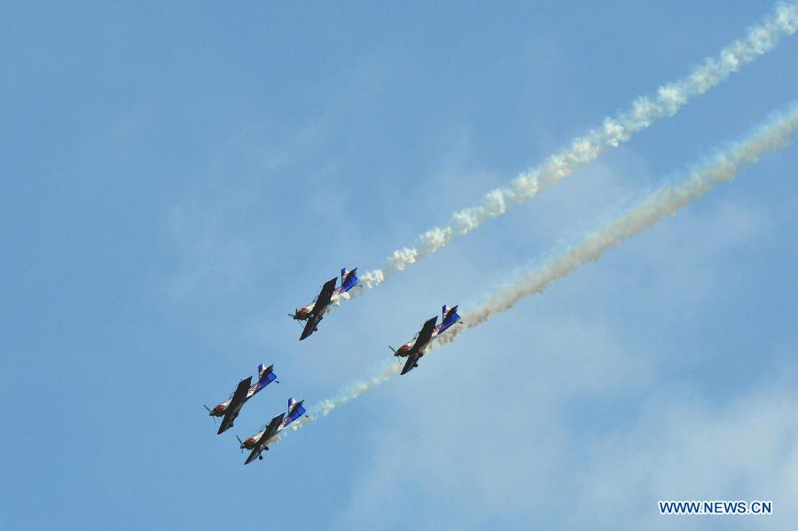 Flying Bulls Aerobatics Team perform during the Airpower 13 air show in Zeltweg, Steiermark of Austria, June 28, 2013. (Xinhua/Qian Yi) 