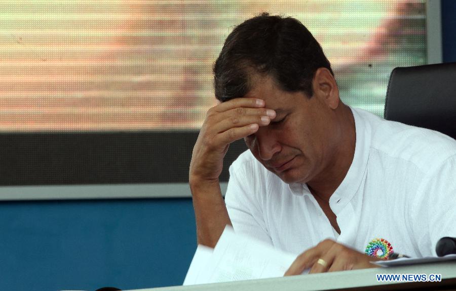 Ecuador's President Rafael Correa takes part in the weekly presentation of presidential work in El Aromo of Manabi Province, Ecuador, on June 29, 2013. Rafael Correa said on Saturday the United States had asked him not to grant asylum for Edward Snowden, a U.S. intelligence agent-turned-whistleblower accused of espionage by Washington, in a telephone conversation he held with U.S. Vice President Joe Biden. (Xinhua/Santiago Armas)