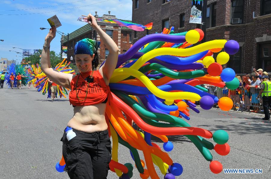 A woman participates in the annual Gay Pride Parade in Chicago, the United States, June 30, 2013. (Xinhua/Jiang Xintong) 