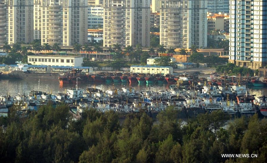 Ships berth at Xiuying harbour in Haikou, capital of south China's Hainan Province, July 1, 2013. Tropical storm Rumbia reached the South China Sea area at noon Sunday and is expected to move northwestward in the coming 24 hours, according to the National Marine Forecast Station (NMFS). It is expected to turn into a strong tropical storm and land on some coastal areas in the western part of south China's Guangdong Province and the northeastern part of Hainan Province from Monday night to Tuesday daytime, it said. (Xinhua/Zhao Yingquan) 