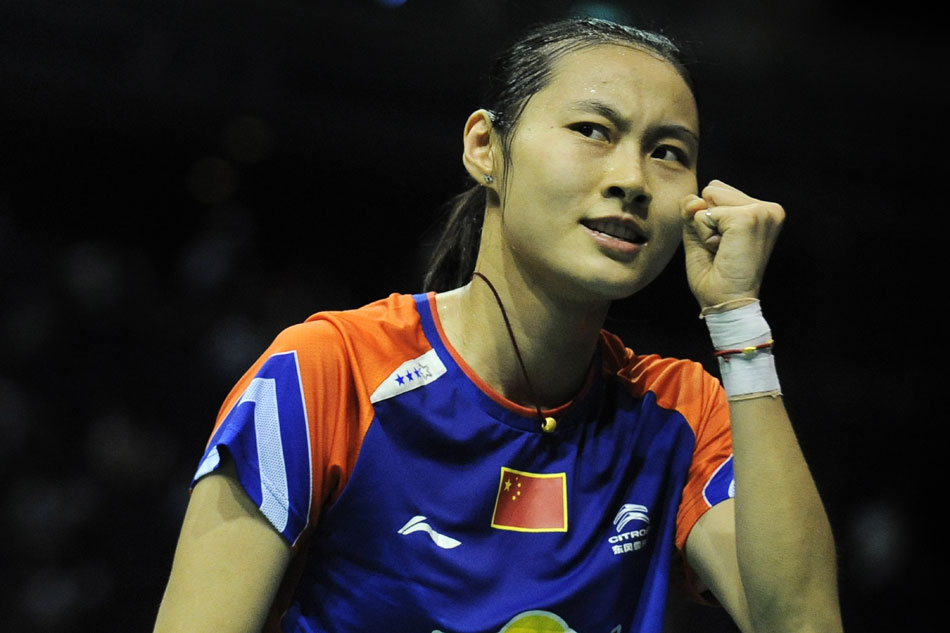 Wang Yihan wins the championship in the women's singles final in Singapore Badminton Open on June 23, 2013. (Xinhua/Deng Zhiyou)