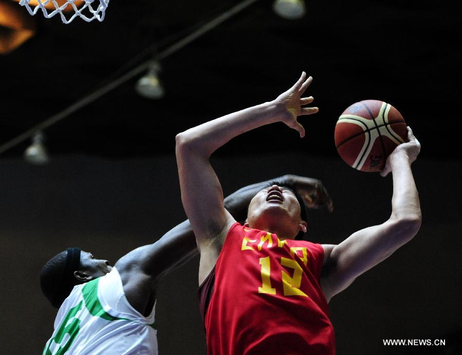 Chang Lin of China goes up for a shot during a match against Nigeria at the Stankovic Continental Cup 2013 in Lanzhou, northwest China's Gansu Province, June 30, 2013. China lost the match 57-60. (Xinhua/Nie Jianjiang)