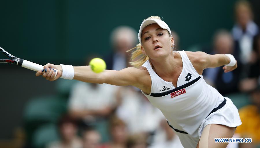 Agnieszka Radwanska of Poland returns the ball during the quarterfinal of ladies' singles against Li Na of China on day 8 of the Wimbledon Lawn Tennis Championships at the All England Lawn Tennis and Croquet Club in London, Britain on July 2, 2013. (Xinhua/Wang Lili)