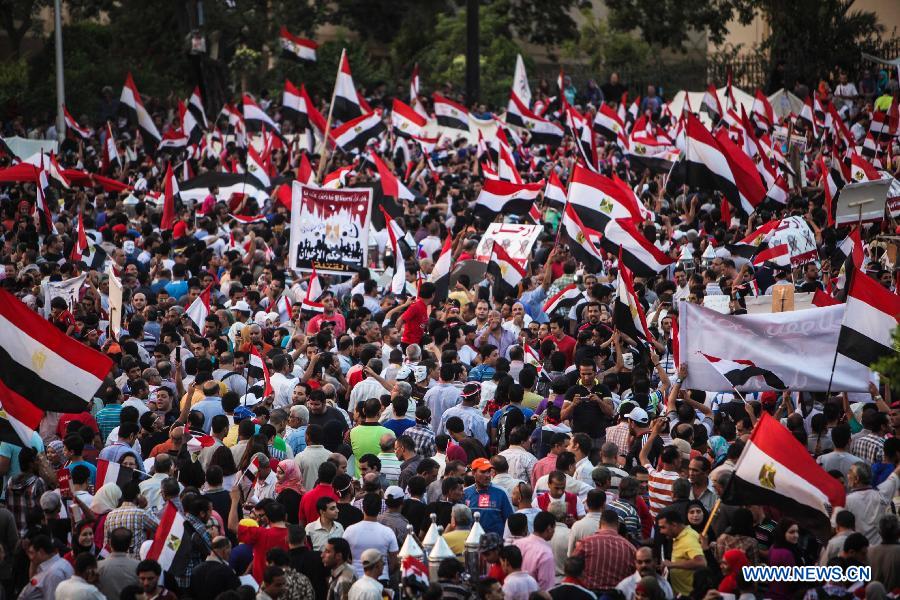 Egyptian take part in an opposition rally in front of Al-Qoba presidential palace in Cairo, Egypt, July 2, 2013. Egyptian President Mohamed Morsi said late Tuesday that there will be no alternative for "constitutional legitimacy," amid the ongoing political division in his country, where the opposition and liberal are asking him to quit power. (Xinhua/Amru Salahuddien)