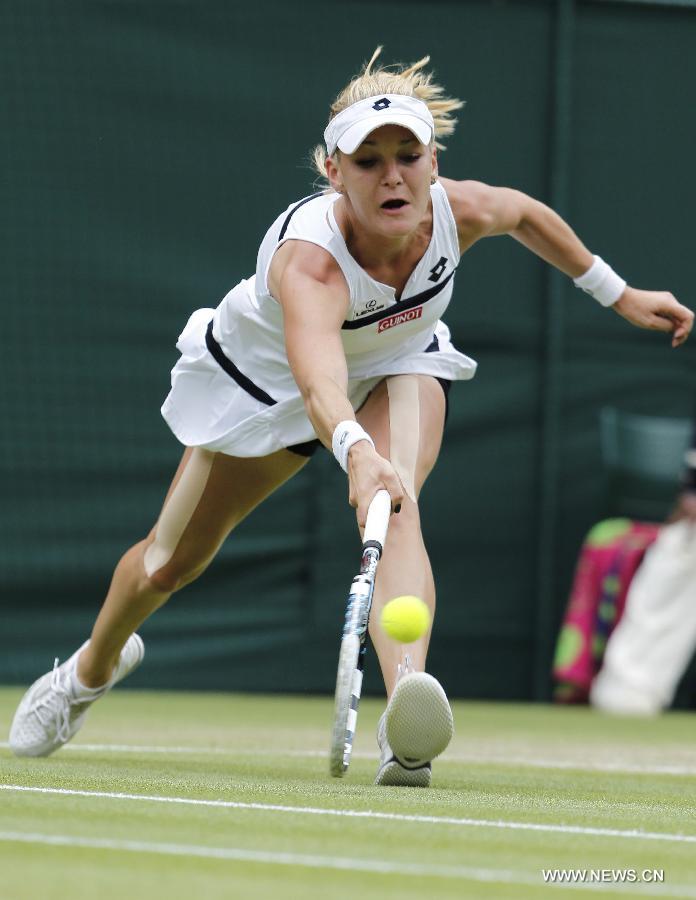 Agnieszka Radwanska of Poland returns the ball during the quarterfinal of women's singles against Li Na of China on day 8 of the Wimbledon Lawn Tennis Championships at the All England Lawn Tennis and Croquet Club in London, Britain on July 2, 2013. Agnieszka Radwanska won 2-1. (Xinhua/Yin Gang) 