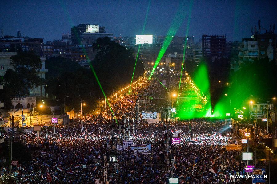 Opponents of Egyptian President Mohammed Morsi pray at Cairo's Tahrir Square, Egypt, on July 3, 2013. Egypt's President Mohamed Morsi said Wednesday he would commit to his own roadmap of building a coalition government and setting up a panel for amending the constitution, warning against any other scenarios. (Xinhua/Li Muzi)