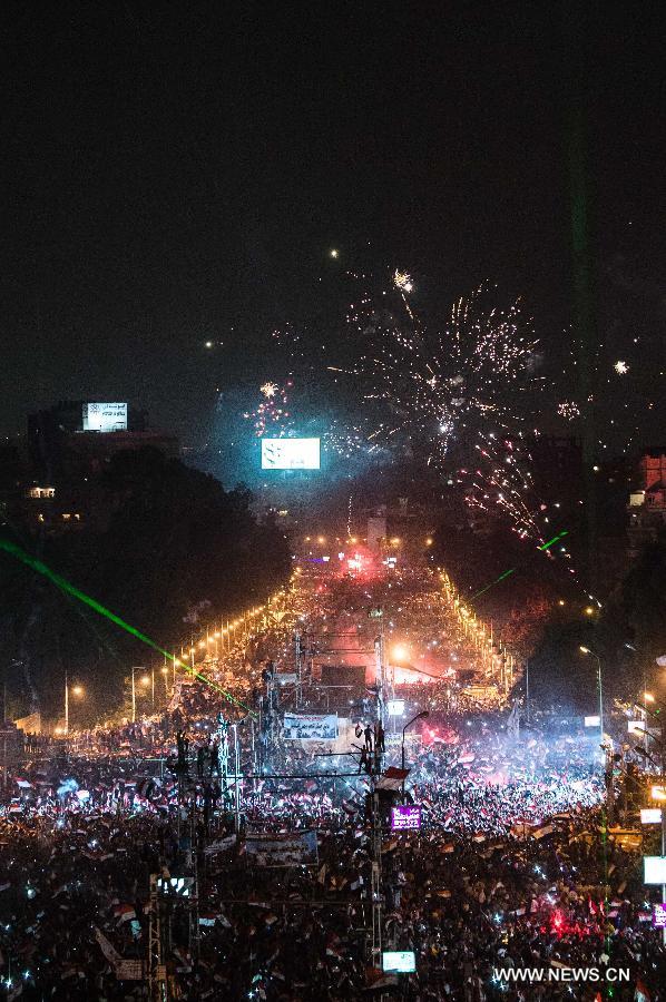 Opponents of Egyptian President Mohammed Morsi celebrate at Cairo's Tahrir Square, Egypt, on July 3, 2013. Egyptian interior ministry expressed complete support to a military statement that revealed a roadmap for running the country after the ouster of Islamist President Mohamed Morsi, the ministry said in a statement Wednesday. (Xinhua/Qin Haishi)