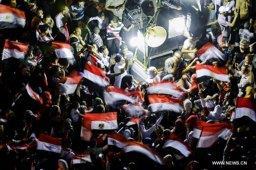 Opponents of Egyptian President Mohammed Morsi celebrate at Cairo's Tahrir Square, Egypt, on July 3, 2013. Egyptian interior ministry expressed complete support to a military statement that revealed a roadmap for running the country after the ouster of Islamist President Mohamed Morsi, the ministry said in a statement Wednesday. (Xinhua/Qin Haishi)