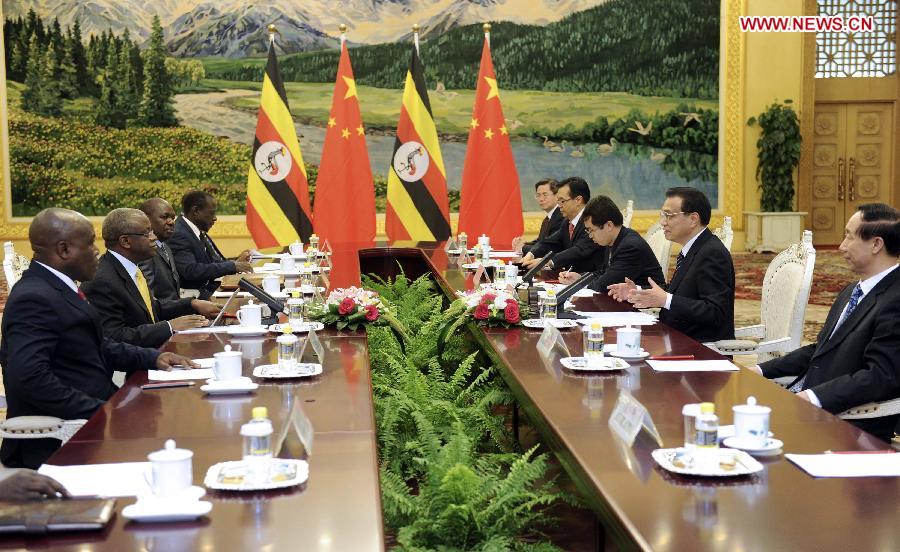 Chinese Premier Li Keqiang (2nd R), also a member of the Standing Committee of the Political Bureau of the Communist Party of China (CPC) Central Committee, meets with Uganda's Prime Minister Amama Mbabazi (2nd L), also secretary general of Uganda's ruling National Resistance Movement (NRM), at the Great Hall of the People in Beijing, capital of China, July 3, 2013. (Xinhua/Zhang Duo)