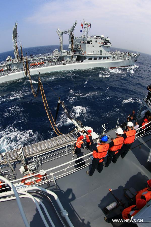 The destroyer Shenyang and comprehensive supply ship Hongze Lake are seen during Sino-Russian joint naval drills held in the sea of Japan, July 4, 2013. (Xinhua/Zha Chunming) 