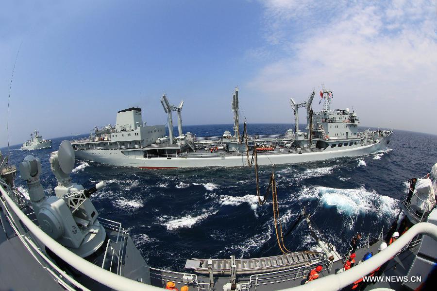 The destroyers Shenyang, Shijiazhuang and comprehensive supply ship Hongze Lake are seen during Sino-Russian joint naval drills held in the sea of Japan, July 4, 2013. (Xinhua/Zha Chunming) 