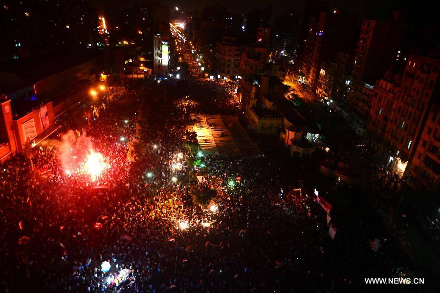 Egyptians celebrate after the announcement made by the Egyptian Defense Minister Abdel-Fattah al-Sisi of a presidential handover in Alexandria, Egypt, on July 3, 2013. Egypt's ousted President Mohamed Morsi said he is still the legitimate president of Egypt in a prerecorded statement broadcast by pan-Arab Al Jazeera news channel on Wednesday evening. Morsi, according to local sources, has been moved to an undisclosed location. (Xinhua/STR)