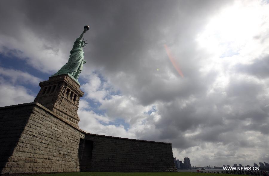 The Statue of Liberty is seen on the Liberty Island in New York, the United States, on July 4, 2013, the U.S. Independence Day. The Statue of Liberty and Liberty Island reopened to the public on Thursday for the first time since Hurricane Sandy made landfall on Oct. 29, 2012. (Xinhua/Cheng Li) 