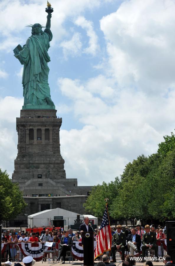 New York Mayor Michael Bloomberg addresses the reopening ceremony of the Statue of Liberty at Liberty Island in New York, the United States, on July 4, 2013, the U.S. Independence Day. The Statue of Liberty and Liberty Island reopened to the public on Thursday for the first time since Hurricane Sandy made landfall on Oct. 29, 2012. (Xinhua/Wang Lei) 