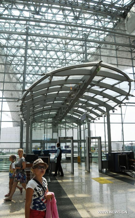 Passengers are seen in the Terminal D at Moscow's Sheremetyevo International Airport, Russia, on July 4, 2013. Moscow will not influence the circumstances around Edward Snowden because the NSA leaker has not appealed for political asylum in Russia, a high-ranking diplomat said Thursday. (Xinhua/Ding Yuan) 