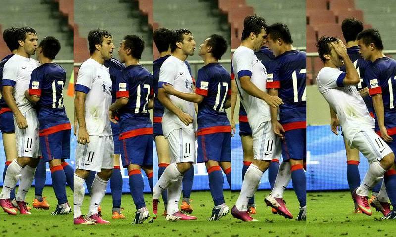 Raphael from Guangzhou Fuli clash with Bo Jiajun  from Shenhua in round 15 of China's Super League, June 30, 2013.  (Photo/Osports)