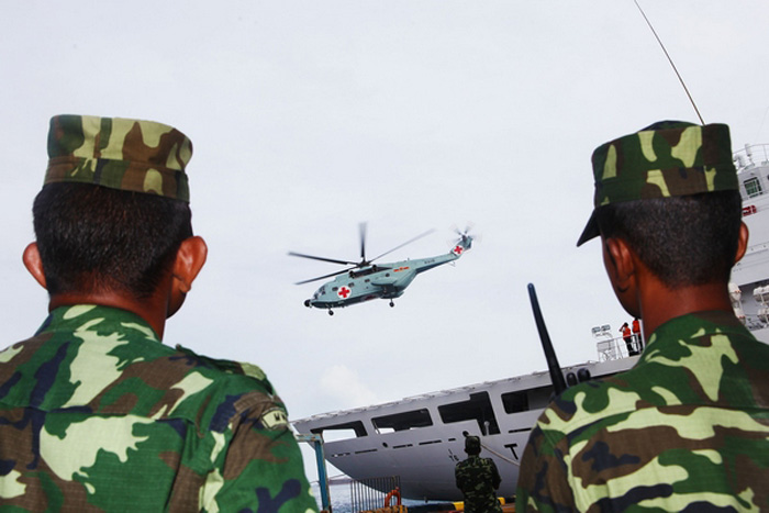 A Chinese ship-based medical helicopter takes off from the naval hospital ship Hepingfangzhou on July 1, 2013, at the port of Male, capital of Maldives. It is the first time that the Chinese navy's medical helicopter was involved in a medical mission outside China. The helicopter concluded the mission the same day, diagnosing and treating more than 220 patients in Maldives. The mission started on July 1. (Photo/Xinhua)