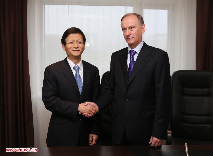 Meng Jianzhu (L), a member of the Political Bureau of the Communist Party of China (CPC) Central Committee and secretary of the Commission for Political and Legal Affairs of the CPC Central Committee, meets with Nikolai Patrushev, secretary of the Security Council of Russia, in Vladivostok, Russia, on July 2, 2013. (Xinhua/Hao Fan)